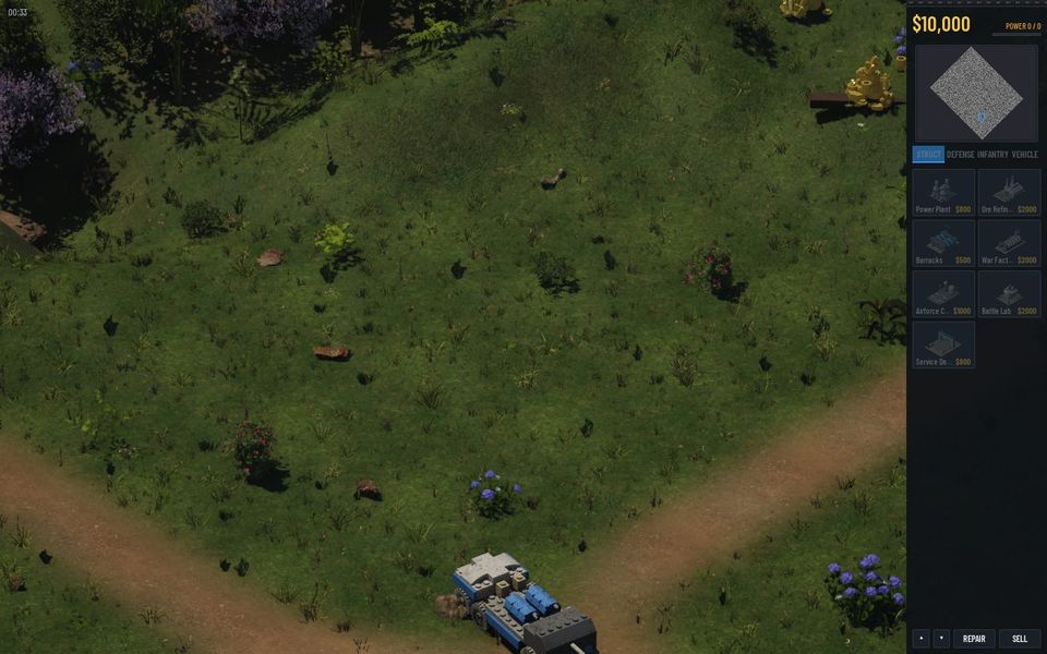 A hillside view of a lawn-green island with two dirt roads and a small blue vehicle on one of them
